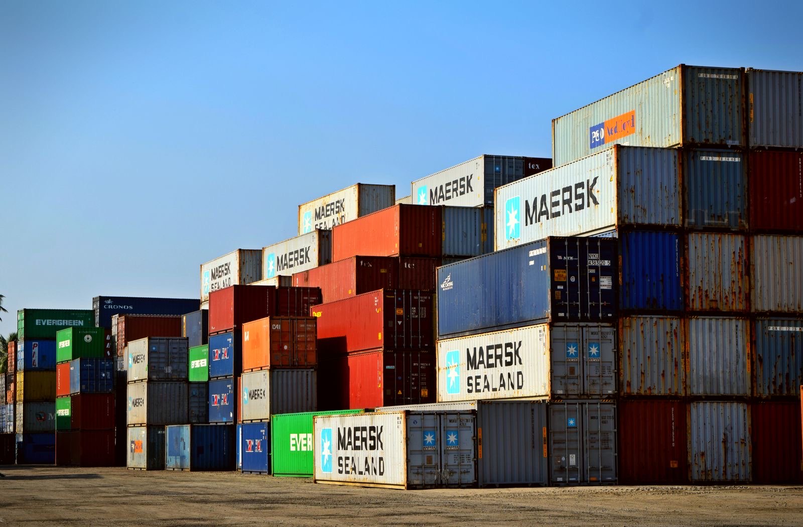 Stacked shipping containers at a drayage yard