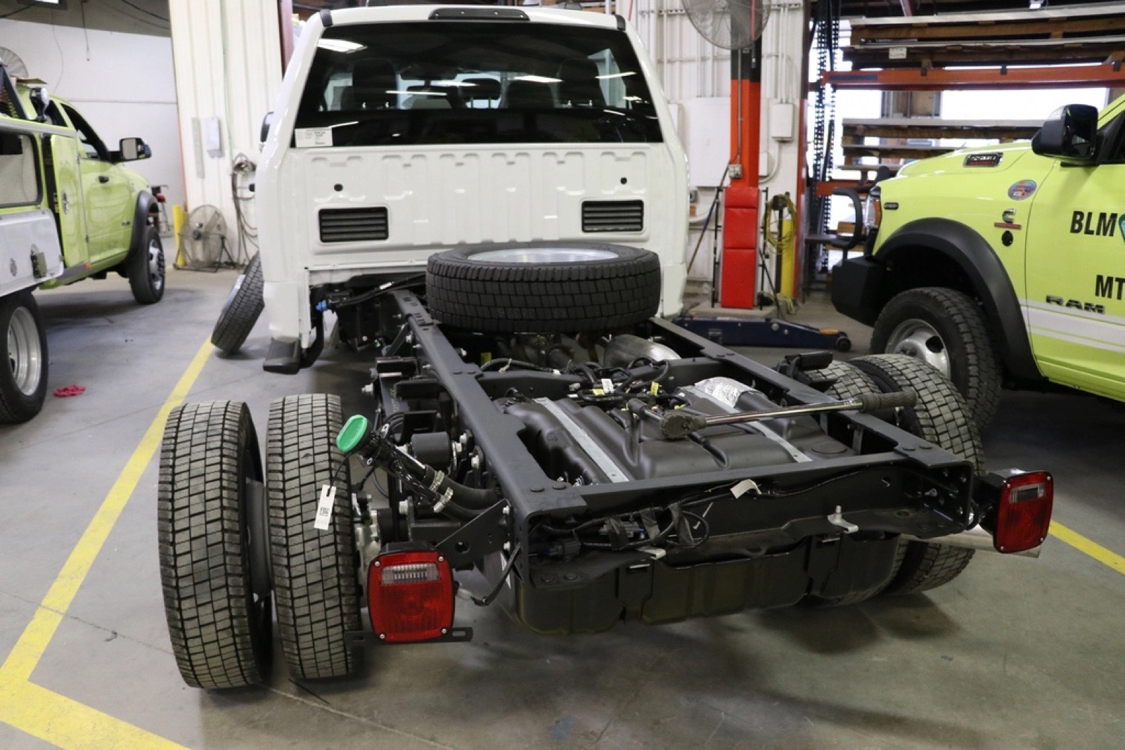 Commercial trucks in a service shop bay